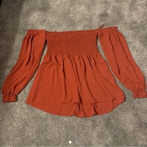 Express off the shoulder top in rust